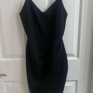 Black Spaghetti strap mini dress cross over. Never worn.